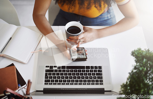 Image of Coffee, top view of businesswoman with a cellphone and laptop by her desk in modern office. Networking or technology, communication and black woman with smartphone on social media at workplace