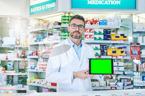 Image of Man, pharmacist and tablet with green screen in store for product, empty and pharmaceutical promo on app. Mature pharma expert, digital touchscreen and space with chromakey for mock up in portrait