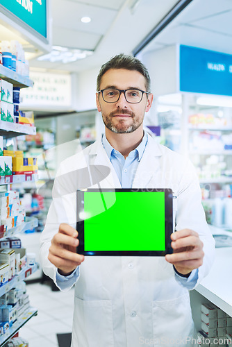 Image of Man, pharmacy and tablet with green screen with healthcare, shop or mockup for pharmaceutical promo on app. Mature pharma expert, digital touchscreen and space with chromakey for mock up in store