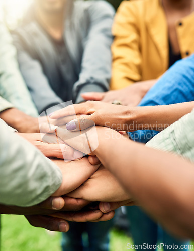 Image of Friends, support and stack of hands of people for motivation, community and friendship outdoors. Teamwork, diversity and huddle of men and woman together for trust, commitment and solidarity in park