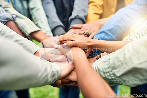 Image of Friends, community and stack of hands of people for motivation, support and friendship goal outdoor. Teamwork, diversity and men and woman huddle together for trust, commitment and solidarity in park