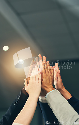 Image of High five, teamwork and hands of business people in office for celebration, team building and motivation. Goals, collaboration and workers with hand together for agreement, support and success