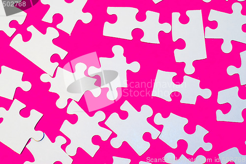 Image of Puzzle Pieces On Pink