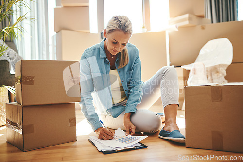 Image of Woman, paperwork and boxes in apartment on the floor for investment in real estate for house. Document, lease and person with agreement for new home in living room with rent for property and growth.