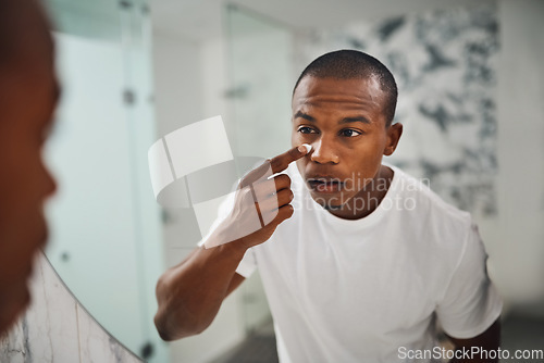 Image of Cream, skincare and mirror with black man in bathroom for beauty, morning routine and grooming. Cleaning, hygiene and self care with reflection of male person at home for facial, glow and lotion