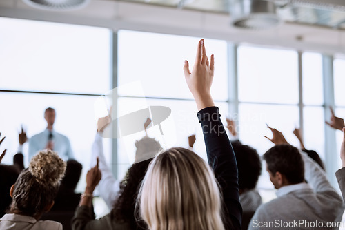 Image of Conference, group and business people with hands for a vote, question or volunteering. Corporate event, meeting and hand raised in a training seminar for questions, voting or audience opinion
