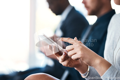 Image of Hand, phone and business woman in a meeting or conference while typing for notes or communication. Female entrepreneur in seminar or workshop audience with a smartphone for research or to check email