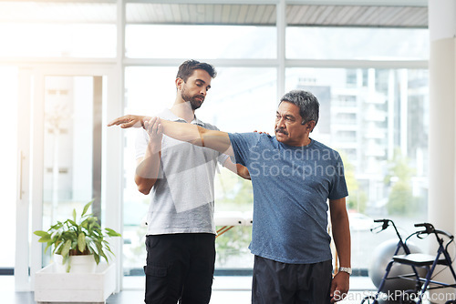 Image of Physiotherapy, stretching and arm with old man and doctor for training, rehabilitation and injury. Medical, healing and healthcare with expert and patient for consulting, help and fitness