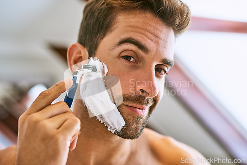 Image of Portrait, man and shaving beard for hair removal, aesthetic skincare and facial cleaning at home. Face of guy, foam and and razor to shave with cream cosmetics, blade and morning routine in bathroom