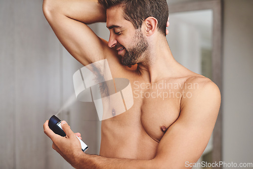 Image of Deodorant, armpit spray and man in bathroom for hygiene, shower or perfume to control underarm sweating. Happy bare guy cleaning body with fragrance cosmetics, skincare product or male beauty at home