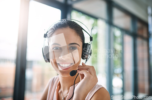 Image of Customer support, portrait and female call center consultant working on online consultation in office. Contact us, headset and face of woman telemarketing agent with crm communication in workplace.