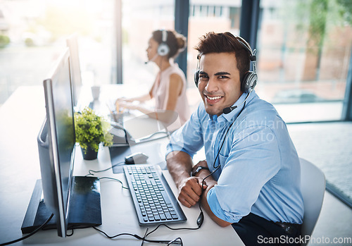 Image of Happy businessman, call center and smile in customer service, support or telemarketing at the office. Portrait of friendly man person, face or consultant agent smiling for online advice in contact us