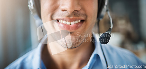 Image of Happy man, teeth and smile in call center with mic for customer service or telemarketing at office. Closeup of friendly male person or consultant agent mouth smiling with headphones in contact us