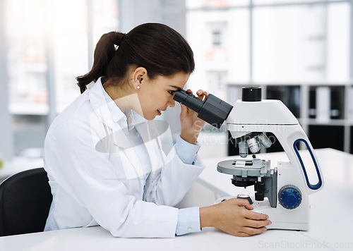 Image of Scientist, research and woman with microscope in laboratory for medical study. Professional, science and female doctor with scope equipment for sample analysis, particle test and lab experiment.