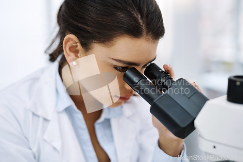 Image of Research, woman and scientist with microscope in laboratory for medical study. Healthcare, science and female doctor with scope equipment for sample analysis, particle testing and lab experiment.