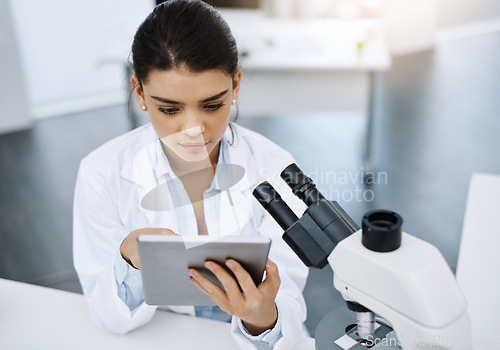 Image of Research, scientist and woman with tablet in laboratory for medical study online. Technology, science and female doctor with touchscreen for website, healthcare and reading, check results or analysis