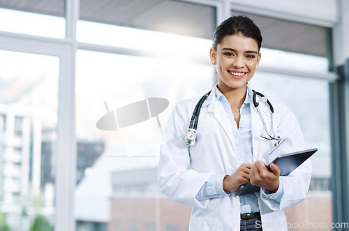 Image of Portrait, doctor and happy woman with tablet in hospital for research, telehealth or healthcare. Face, smile and female medical professional with touchscreen tech for online wellness in clinic.