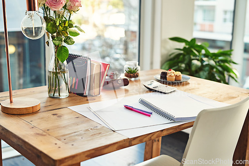 Image of Book, desk and remote work in creative empty workplace with paper for writing, planning or idea inspiration. Notebook, space and workspace table for freelance business in home office creativity room