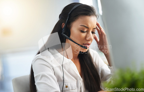 Image of Call center, depression or woman with headache, stress or burnout is overworked by telemarketing deadline. Depressed, sad face or tired sales agent frustrated with migraine pain in customer services