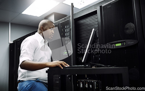 Image of Engineer, black man or coding on laptop in server room for big data, network glitch or digital website. Code, IT support or technician typing on computer testing, programming or software development