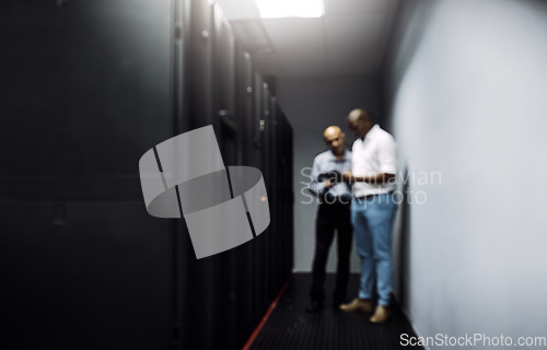 Image of Server room, men or blurry technicians on technology together for cybersecurity glitch with teamwork. Coding IT support code, collaboration or African engineers fixing network for information tablet