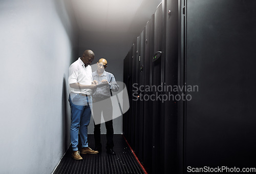 Image of Server room, people or technicians with tablet for cybersecurity or internet glitch with teamwork. IT support help, collaboration or African engineers fixing network data for information technology