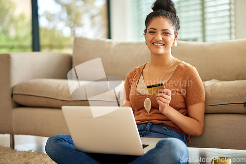 Image of Woman, laptop and credit card with online shopping and payment on store website with fintech and smile in portrait. Female person at home, happy with internet banking and finance with e commerce