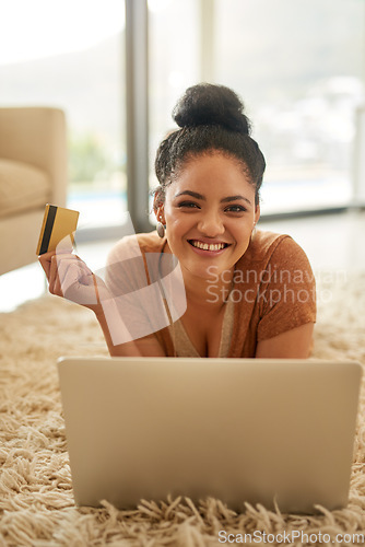 Image of Woman with laptop, portrait with credit card and online shopping with payment on store website, fintech and smile. Female person at home, happy with internet banking and finance with e commerce