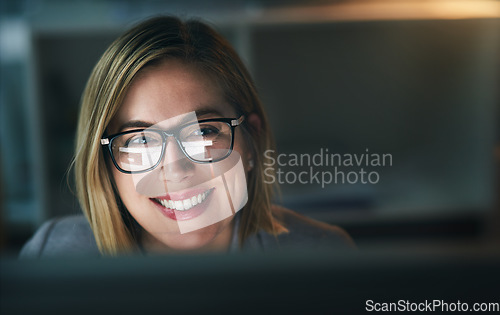 Image of Happy, businesswoman and working late on a computer or overtime for a project deadline or schedule and in an office. Research, email and corporate worker with smile or analysis and report at night