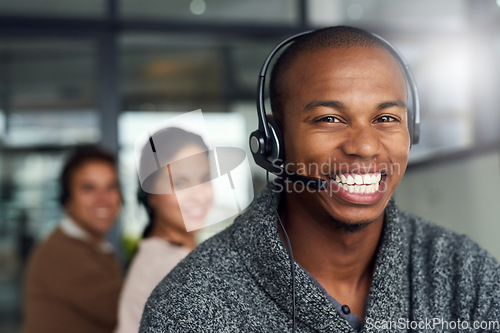 Image of Call center, portrait and male telemarketing consultant in office doing online consultation. Happy, contact us and face of man customer support agent with headset working on crm strategy in workplace