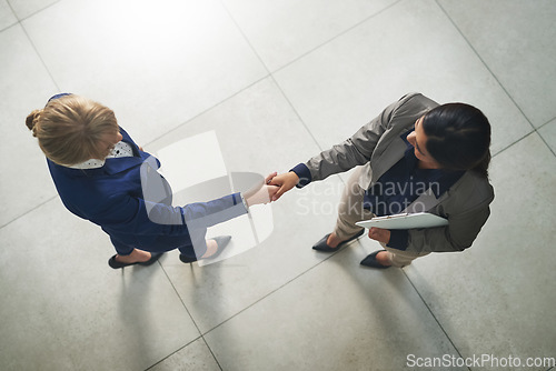 Image of Handshake, acquisition or above of business people at investment deal, b2b contract agreement or meeting. HR hiring welcome, team or women in job interview negotiation with human resources manager