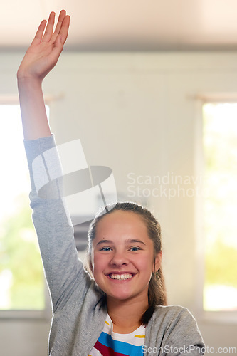 Image of Question, school and hand of girl in classroom for answer in lesson, learning or education development. Happy portrait, knowledge and young student with hands raised for asking, feedback or questions