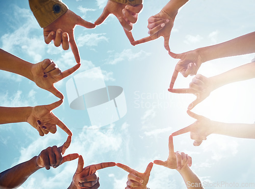 Image of Peace, star and hands of friends on blue sky background with support, collaboration and solidarity. V sign, fingers shape of people outdoor for community, goal and social happiness, voice or union