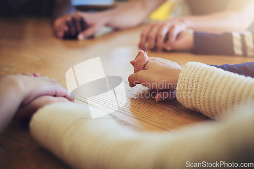 Image of Circle, group and holding hands with people, praying and support for faith, trust or solidarity on desk. Teamwork, helping hand and together with pray, religion or spiritual with mindfulness on table