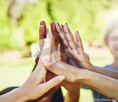 Image of Hands, friends and high five at a park for teamwork, collaboration and volunteering motivation. Hand connection, people and volunteer group outdoor for community, clean up and charity mission help