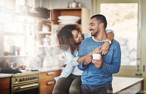 Image of Love, coffee and happy couple in kitchen, morning hug in home with smile, hugging and healthy relationship. Happiness, man and woman embrace with affection, romance and young people in apartment.