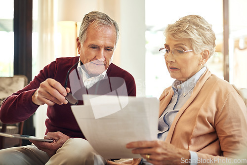 Image of Financial, insurance and reading with an old couple in their home for retirement or pension planning. Accounting, money debt or investment with a senior man and woman in a house for finance budget