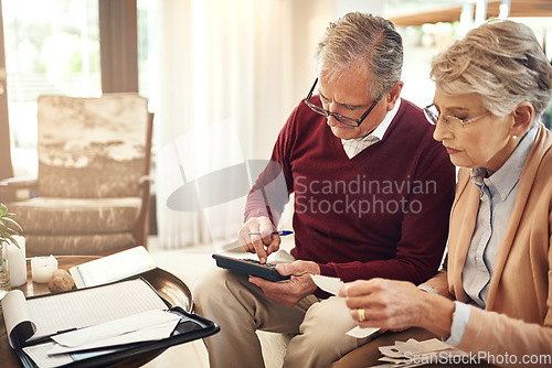 Image of Finance, calculator and budget with an old couple in their home for retirement or pension planning. Debt bills, money or investment with a senior man and woman in their house for financial insurance