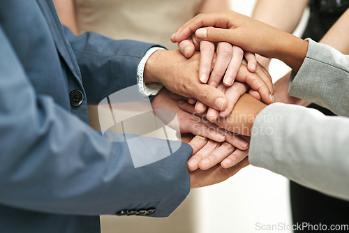 Image of Business people, meeting and hands together in agreement for collaboration at the office. Hand of group piling for teamwork motivation, trust or support in solidarity for company goals at workplace