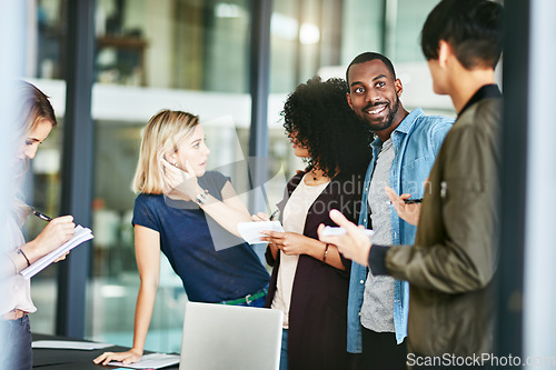 Image of Teamwork, office and business people in meeting discussion for collaboration, planning and project. Communication, diversity and men and women in conversation, talking and brainstorming for strategy