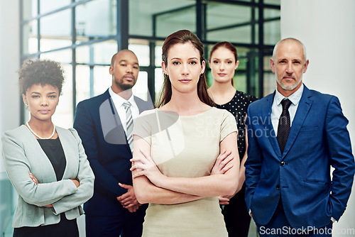 Image of Portrait, business people and serious group with arms crossed in diversity, executive commitment or confident in office. Woman, leadership and global team of professional corporate employees together