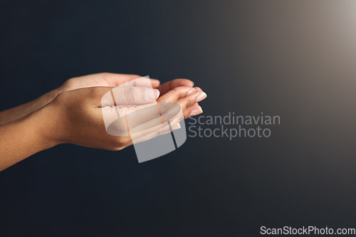 Image of Hands open, charity and begging in studio with poverty, asking and donation of a poor person. Gray background, mockup and economic crisis with woman holding hand and palm for care, aid and kindness