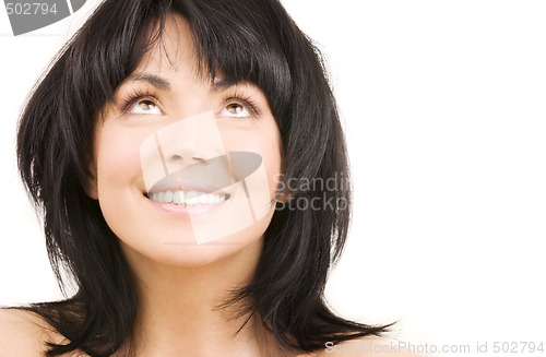 Image of happy woman looking up over white