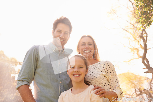 Image of Nature, sunshine and happy portrait of family, parents and child support, bonding and enjoy outdoor quality time together. Sky, spring flare and happiness of mother, father or kid smile for love care