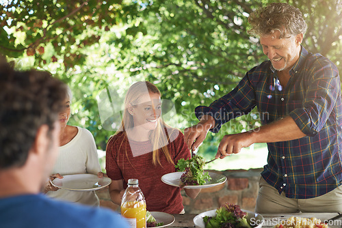 Image of Food, party and serving with family at lunch for health, bonding and celebration. Vacation, social and event with parents and children eating together for dining, generations and wellness