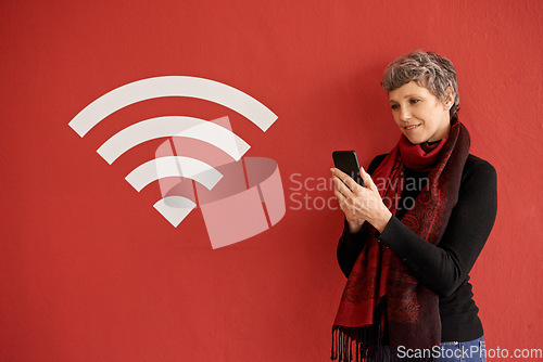 Image of Senior woman, phone and texting by wall with overlay, icon and wireless network with smile by red background. Mature lady, smartphone and reading on social media, chat and blog with connection sign