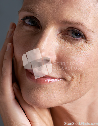 Image of Face, natural and beauty of mature woman doing cosmetic skincare facial in closeup for wellness. Cosmetics, care and portrait of old female model with elderly glow skin due to anti aging dermatology