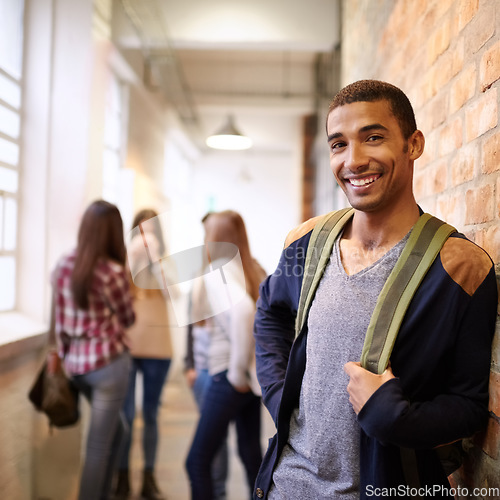 Image of University, education and portrait of man on campus ready for study, knowledge and learning. Scholarship, happy and face of male student in hallway with friends for school, academy and college class