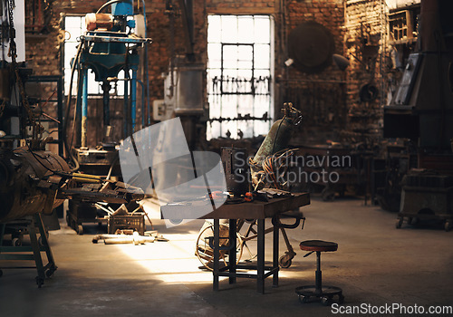 Image of Foundry, workshop and metal tools on desk for industry, manufacturing and manual labor. Industrial factory, welding workspace and table for steel, iron and production for maintenance craftsmanship