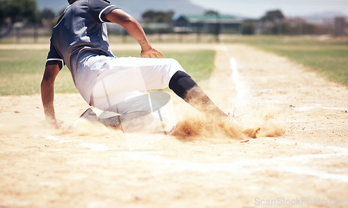 Image of Baseball player, running slide and man on a base at a game with training and dirt. Dust, sport and male athlete outdoor on a field with exercise and run to safe box of runner on sand with competition